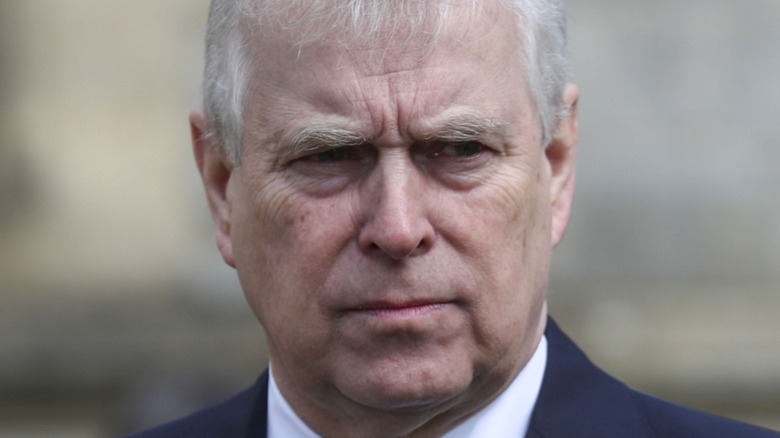 Prince Andrew scowling