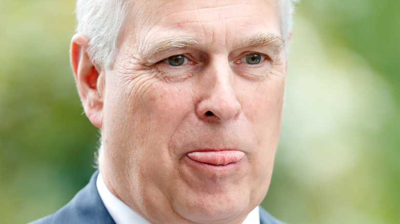 Prince Andrew chews his tongue