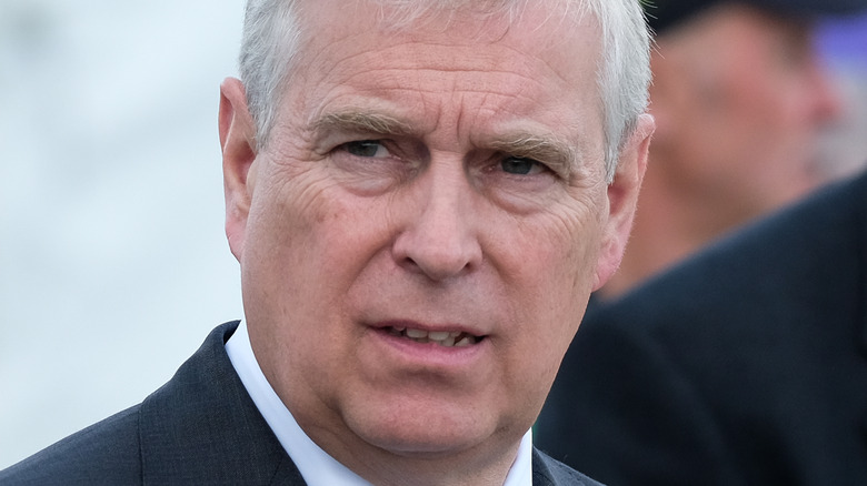 Prince Andrew staring over shoulder 