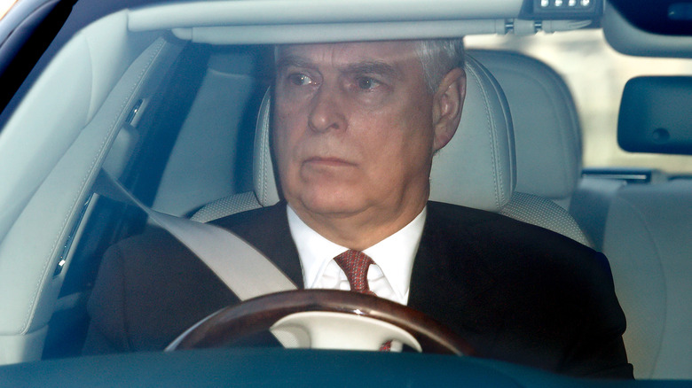 Prince Andrew behind the wheel of a car