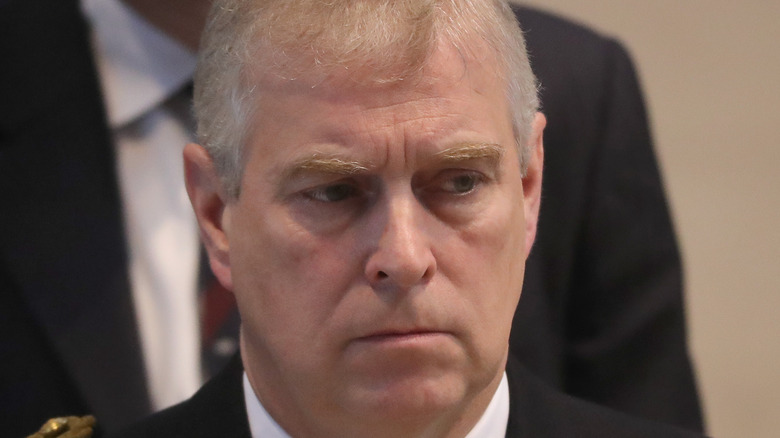 Prince Andrew frowning