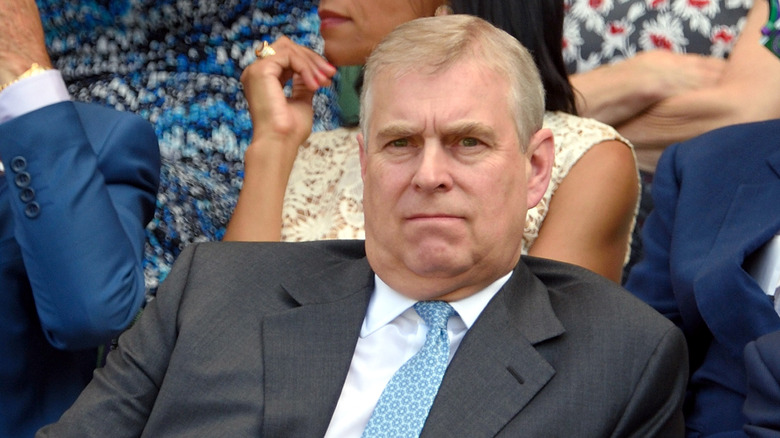 Prince Andrew attending a match at Wimbledon