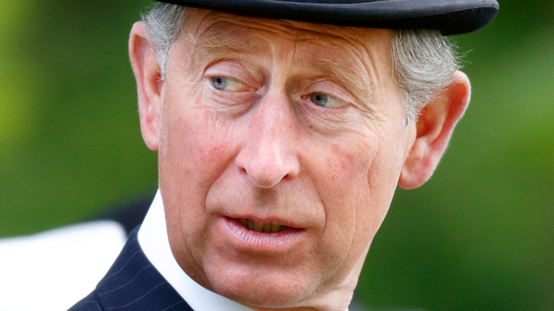 Prince Charles looking away