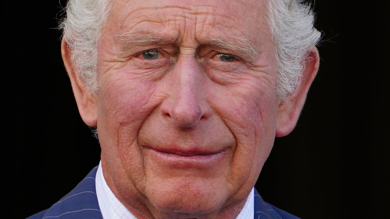 Prince Charles smiling at an event in Scotland