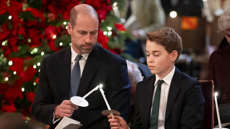 Prince William and Prince George with candles