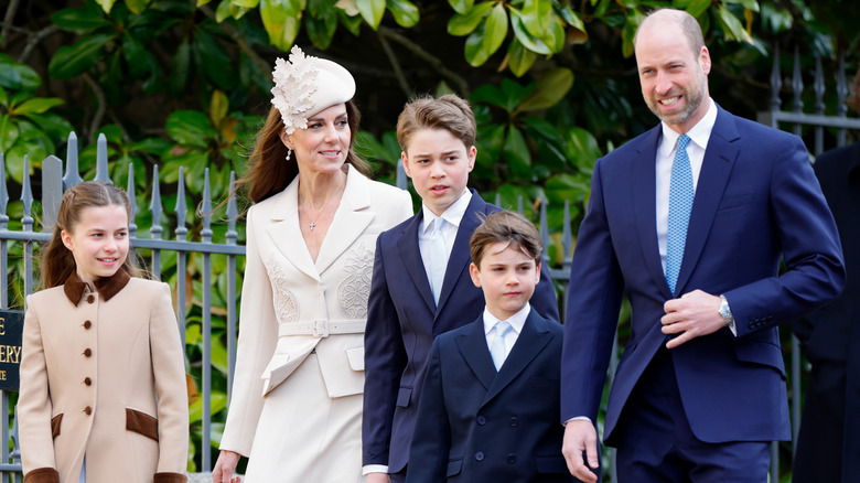 Kate Middleton and Prince William walking with their children