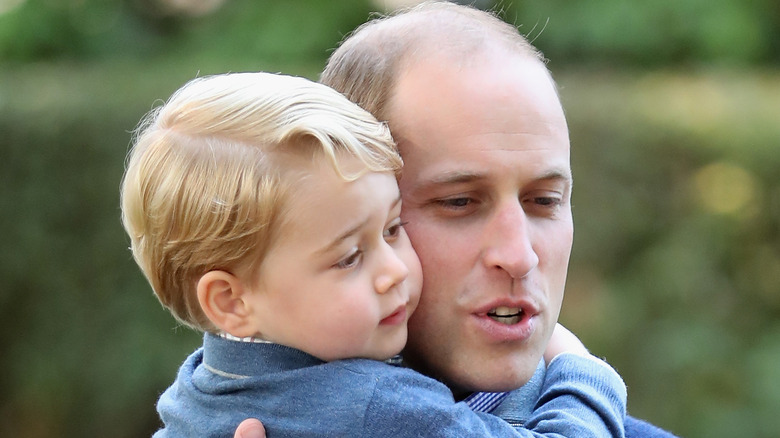 Prince George cuddles with father Prince William