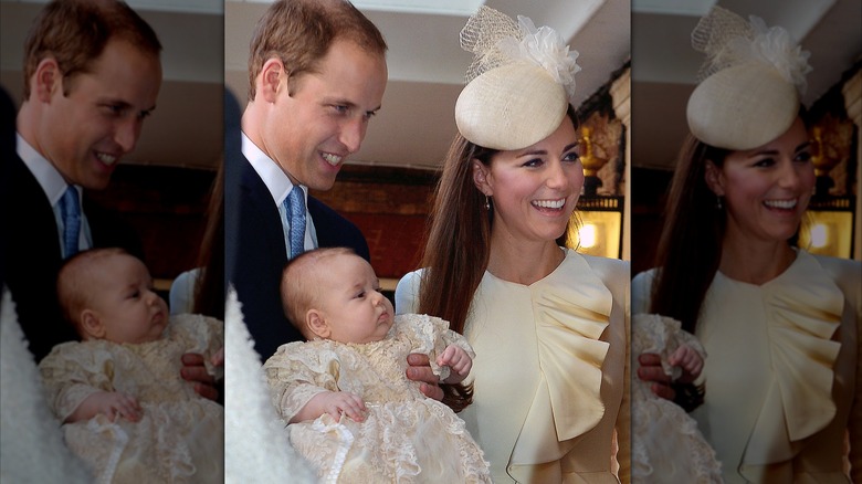 Prince William and Kate Middleton smiling while William holds their son, prince George, ahead of his christening in October 2013