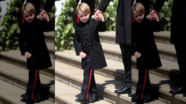 Prince George leaves St George's Chapel at Windsor Castle after the wedding of Prince Harry, Duke of Sussex and Meghan Markle on May 19, 2018 in Windsor, England (2018)