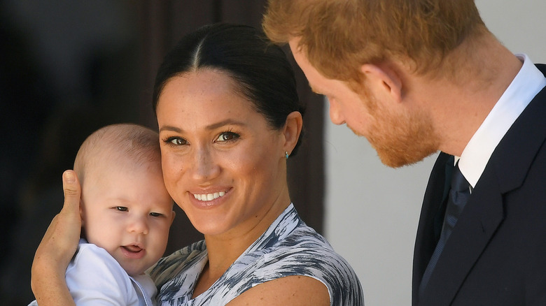 Prince Harry & Meghan Markle posing with Archie 