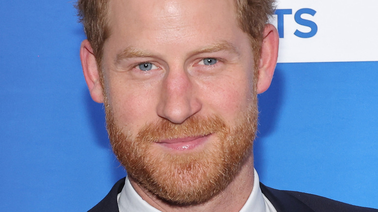 Prince Harry smiling on the red carpet