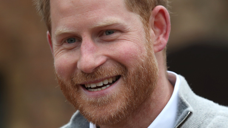 Prince Harry smiling for a photo