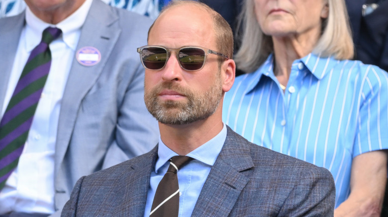Prince William looking cool in a suit and sunglasses