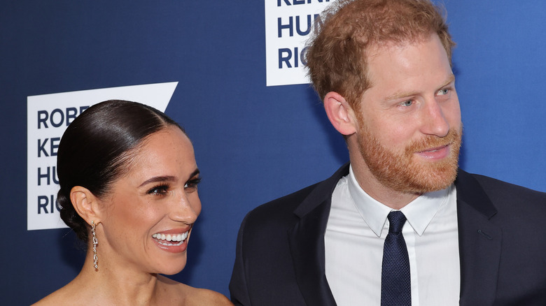 Prince Harry and Meghan Markle smiling