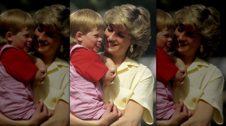 Princess Diana holding young Prince Harry and smiling at him