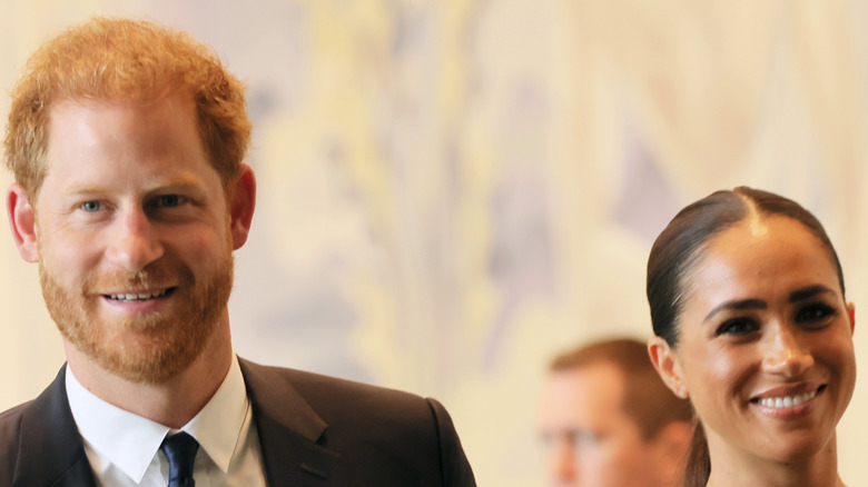 Prince Harry and Meghan Markle smiling at UN HQ