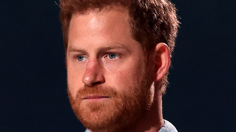 Prince Harry speaks at an event. 