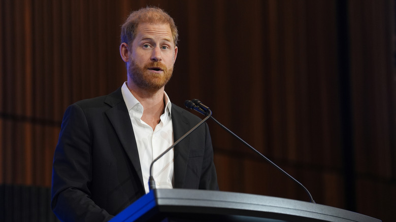 Prince Harry speaking at podium