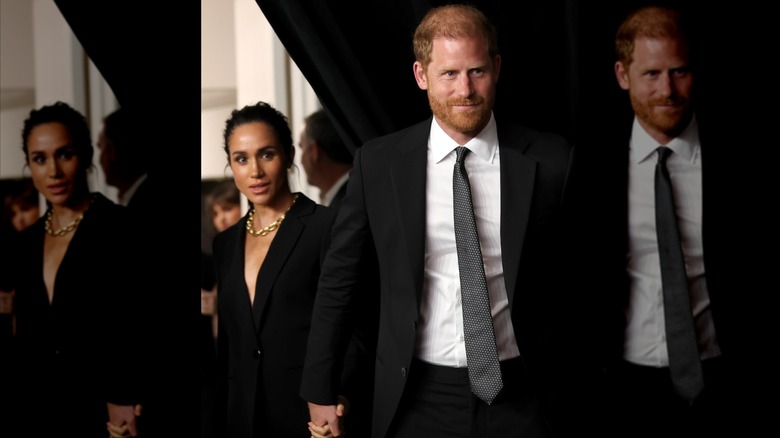 Prince Harry and Meghan Markle holding hands in formal attire