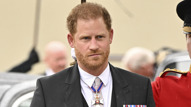 Prince Harry photographed before walking inside