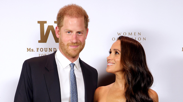 Meghan Markle smiling at Prince Harry