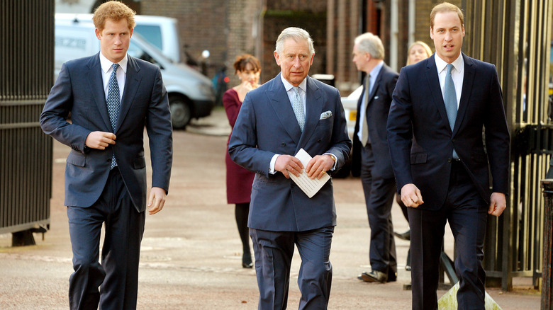 King Charles III flanked by Prince Harry and Prince William