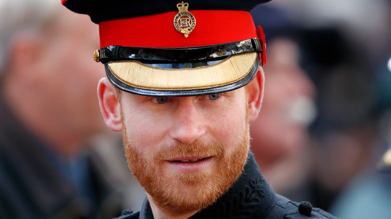 Prince Harry wears his military uniform at an event. 
