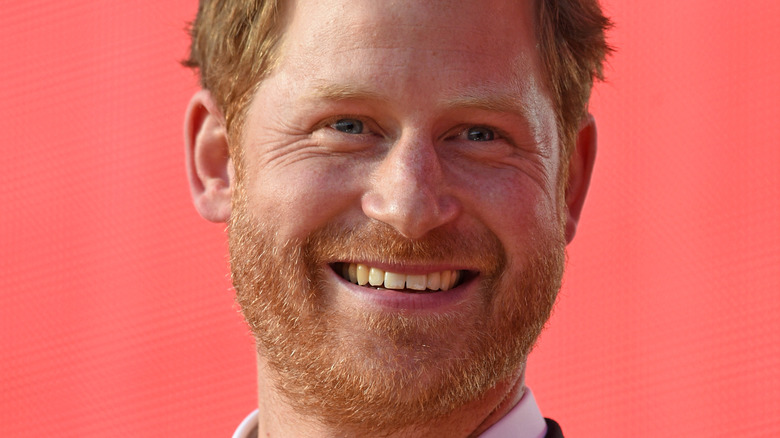 Prince Harry smiles at an event