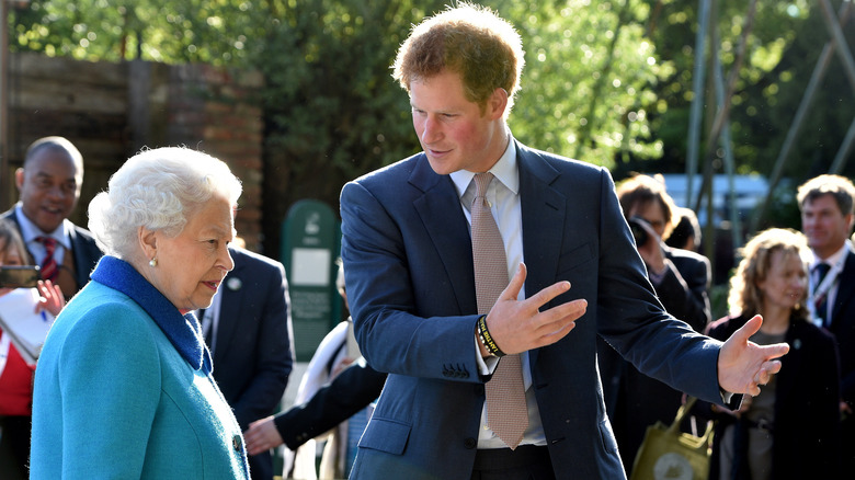 Prince Harry talking to Queen Elizabeth
