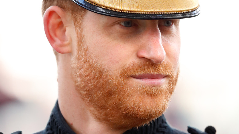 Prince Harry in military uniform with serious expression