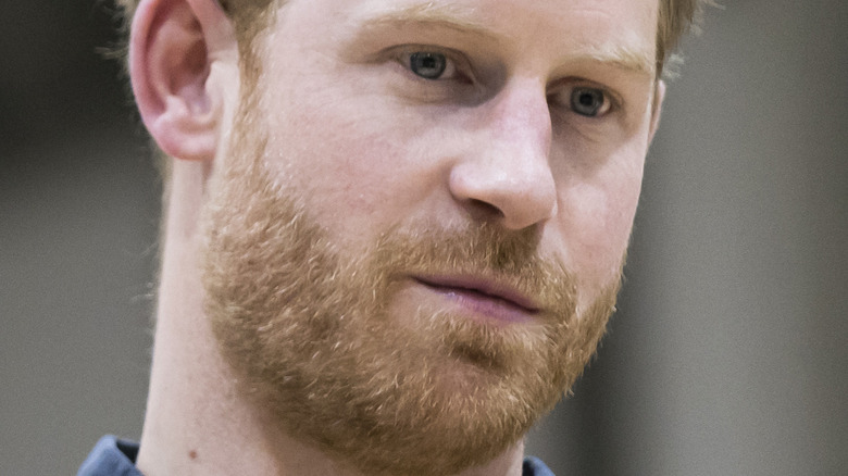 Prince Harry with a neutral expression