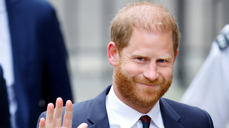 Prince Harry smiling and waving