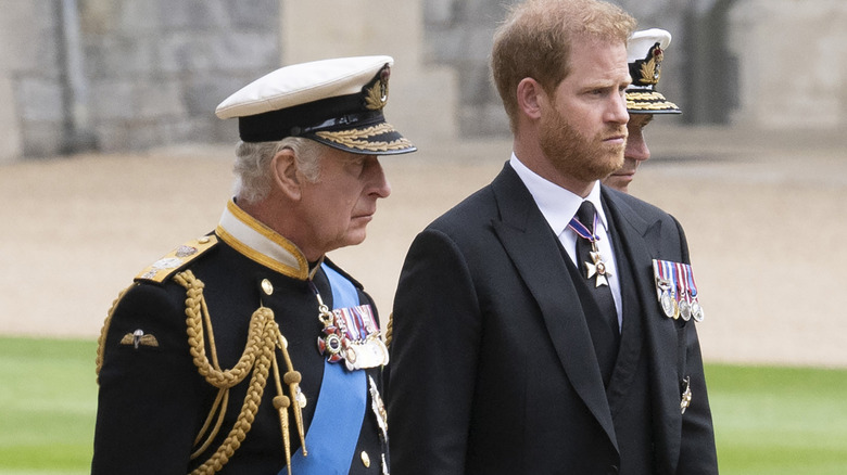 King Charles III and Prince Harry walking