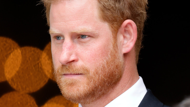 Prince Harry looking serious at an event