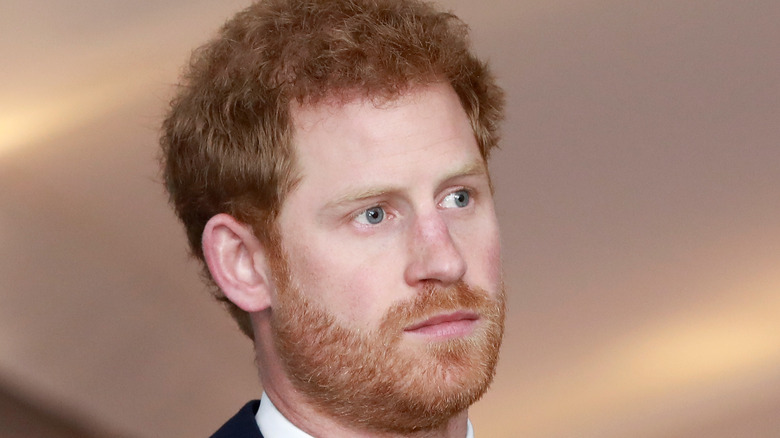 Prince Harry looking serious at an event