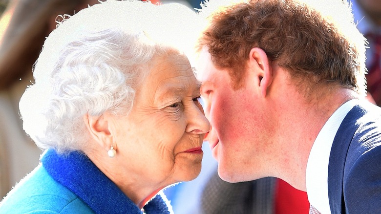 prince harry smiling with queen elizabeth