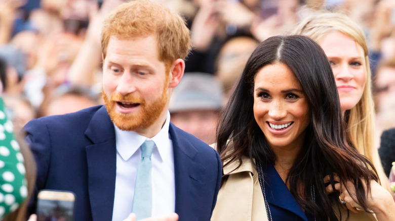 Prince Harry and Meghan Markle in a crowd