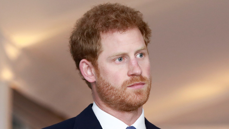 Prince Harry looking on