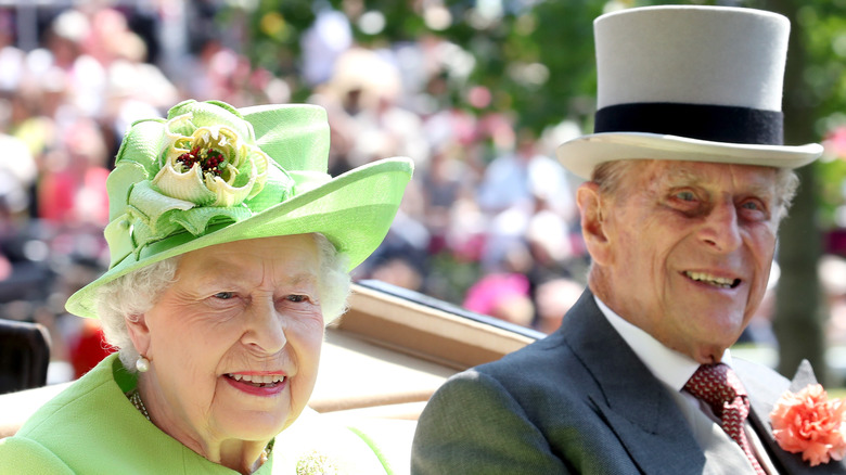 Queen Elizabeth and Prince Charles smiling 