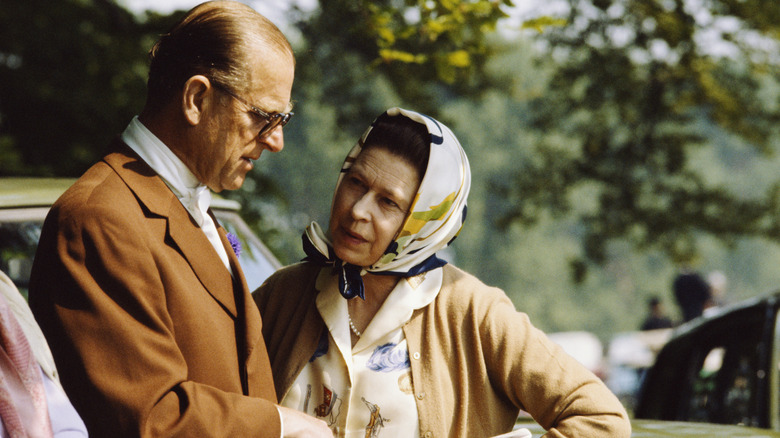 Prince Philip by some cars