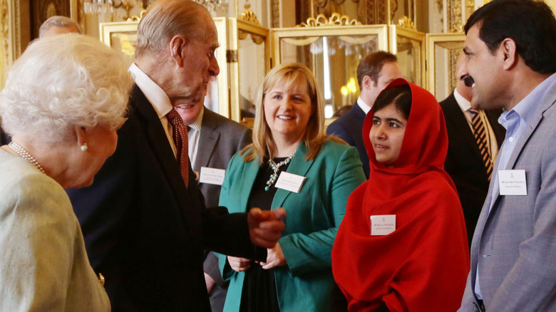 Philip greets Malala