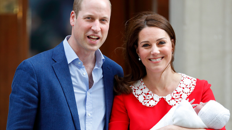 William and Catherine holding baby louis