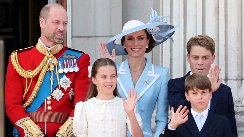 Prince William and Kate Middleton waving alongside their kids