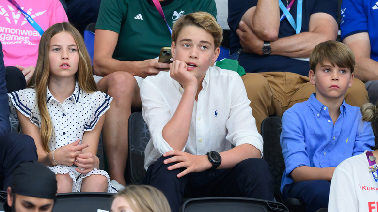Princess Charlotte, Prince George, and Prince Louis sitting together