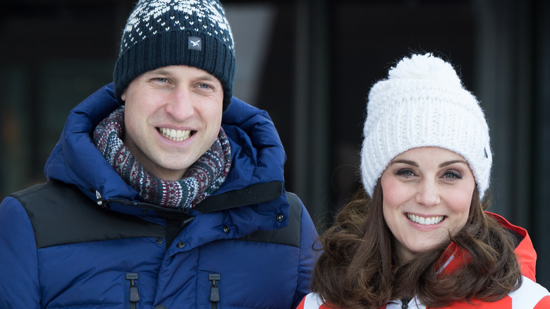 Prince and Princess of Wales wearing ski caps