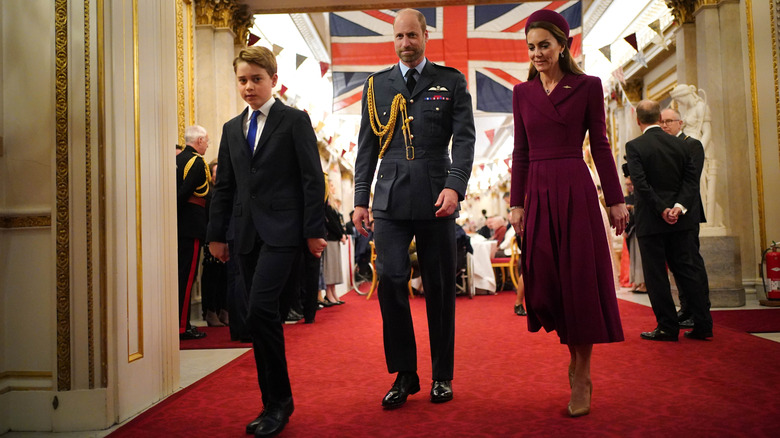 Prince William and Princess Catherine attending a veterans tea party at Buckingham Palace with Prince George
