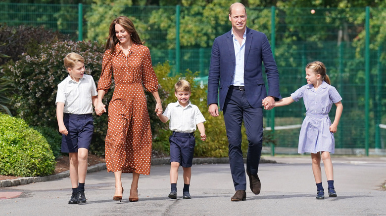 Prince William and Princess Catherine walking their three kids to school in the sunshine