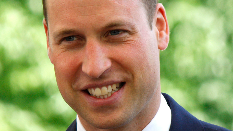 Prince William smiling at an event