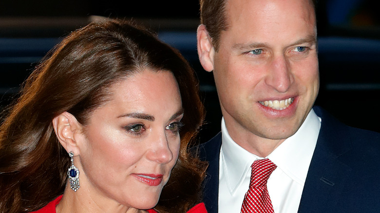 Prince William and Kate Middleton standing together outside