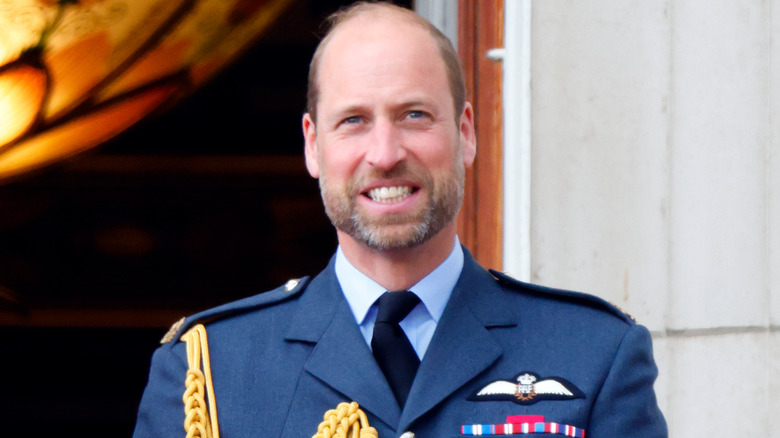Prince William smiling in his formal military attire